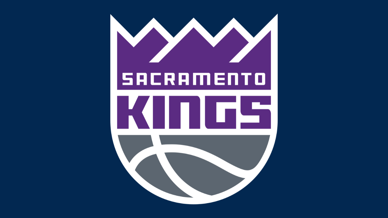 Sacramento Kings logo — purple crown and wordmark above silver basketball on navy background
